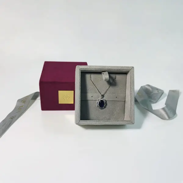 Custom luxury ribbon drawer jewelry box with protective foam insert and branded closure, shown open