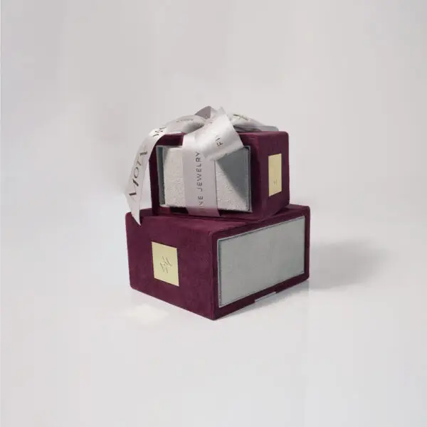 Custom luxury ribbon drawer jewelry box with protective foam insert and branded closure, shown open
