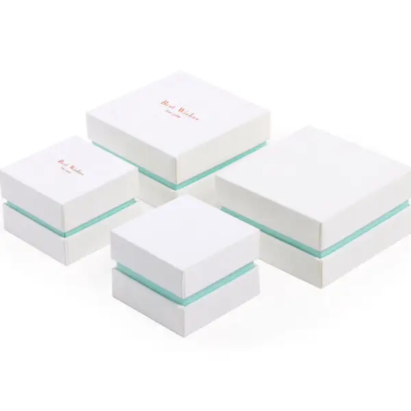 Custom Two-Piece Rigid Gift Box with Handbag Handles – Jewelry Packaging Wholesale Custom two-piece rigid gift box with integrated handbag handles, featuring premium branding and custom foam insert