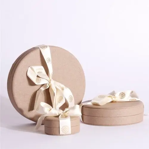 Luxury round custom jewelry set boxes with logo branding, available in multiple materials and finishes
