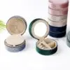 Custom round double-layer travel jewelry case with velvet lining and embroidered branding for retail and bridesmaid gift packaging