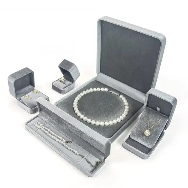 Custom round grey velvet jewelry box with flannelette interior and logo branding