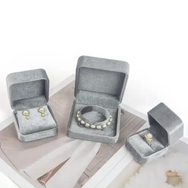 Custom round grey velvet jewelry box with flannelette interior and logo branding
