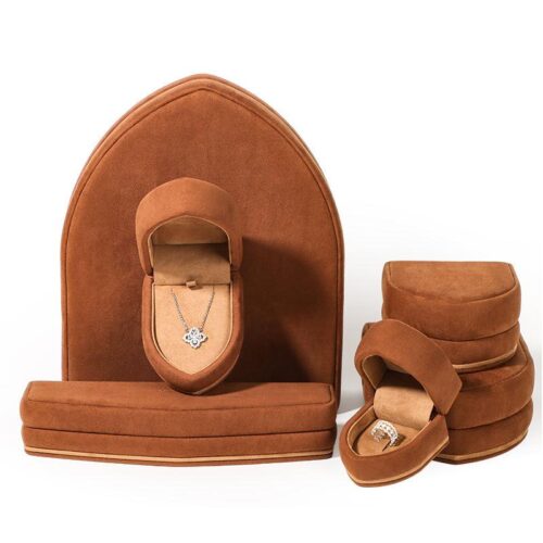 Sail-shaped caramel brown velvet jewelry box with custom logo — factory-direct B2B jewelry packaging by On The Way