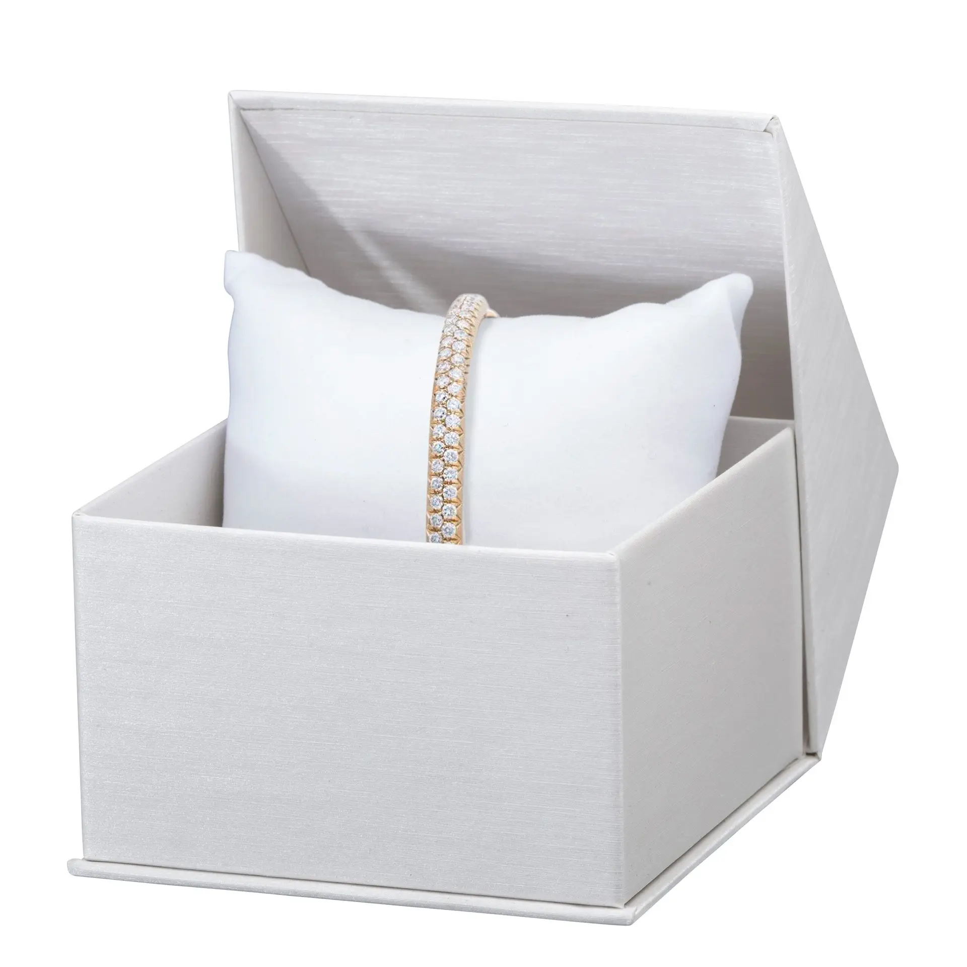 Custom silk-brushed paper pillow boxes with gold foil logo branding and velvet interior insert for jewelry display