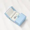 Custom Double-Door Snap Jewelry Box — Rigid Packaging with Logo Branding Custom snap-closure double-door rigid jewelry box with logo printing, foam insert, and branded tissue
