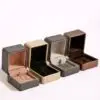 Luxury custom square jewelry box with Italianate design, embossed logo, and protective velvet interior