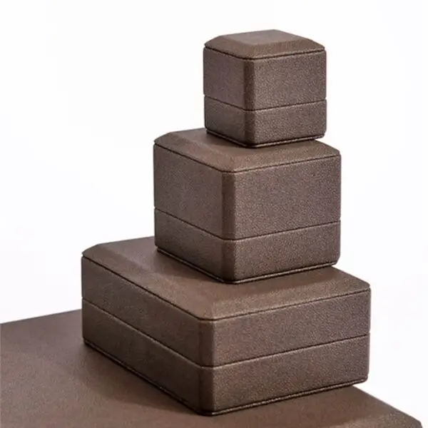 Luxury custom square jewelry box with Italianate design, embossed logo, and protective velvet interior