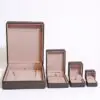 Luxury custom square jewelry box with Italianate design, embossed logo, and protective velvet interior