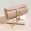 Custom modular travel jewelry roll case with rotating compartments, branded exterior, and internal storage layout