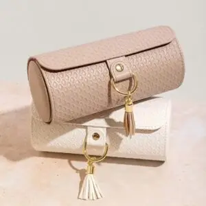 Custom modular travel jewelry roll case with rotating compartments, branded exterior, and internal storage layout
