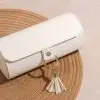Custom modular travel jewelry roll case with rotating compartments, branded exterior, and internal storage layout