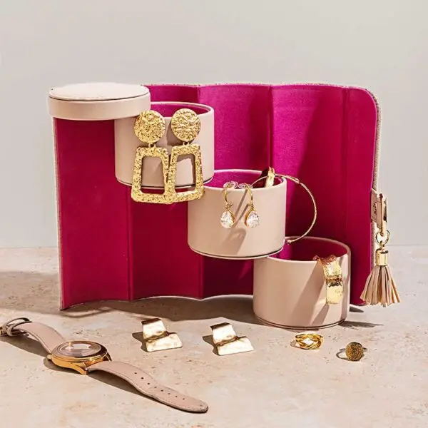 Custom modular travel jewelry roll case with rotating compartments, branded exterior, and internal storage layout