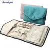 Custom luxury travel jewelry roll with embroidered logo, snap closure, and protective padded compartments