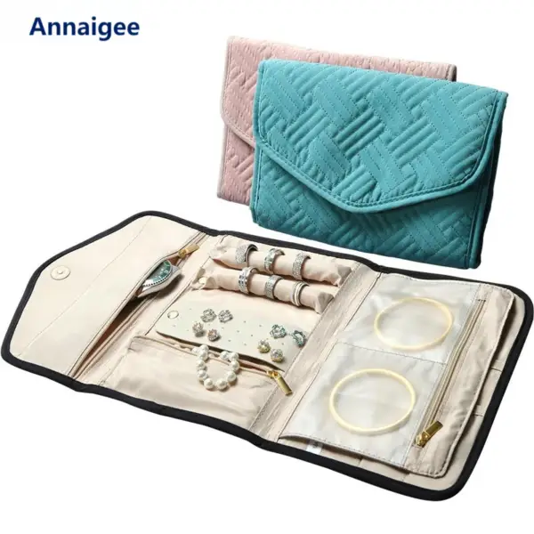 Custom luxury travel jewelry roll with embroidered logo, snap closure, and protective padded compartments