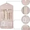 Custom luxury travel jewelry roll with embroidered logo, snap closure, and protective padded compartments