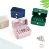 Luxury velvet travel ring storage box with custom logo branding and compartmentalized design