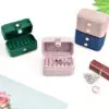Luxury velvet travel ring storage box with custom logo branding and compartmentalized design