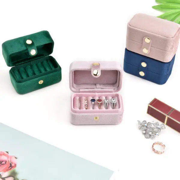 Luxury velvet travel ring storage box with custom logo branding and compartmentalized design