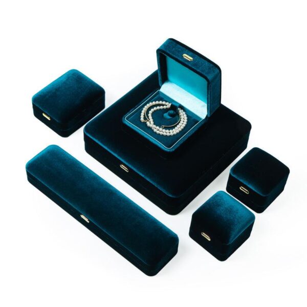 Premium blue velour earring and ring boxes with custom insert padding and logo branding