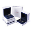 Custom white velvet earring box with branded logo, foam insert, and luxury unboxing packaging for jewelry retailers