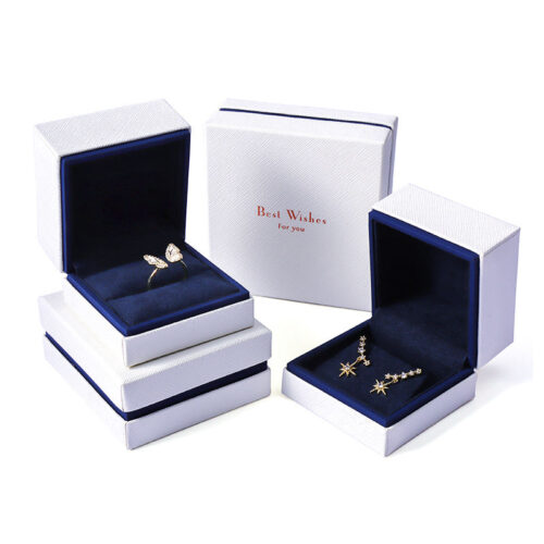 Custom white velvet earring box with branded logo, foam insert, and luxury unboxing packaging for jewelry retailers