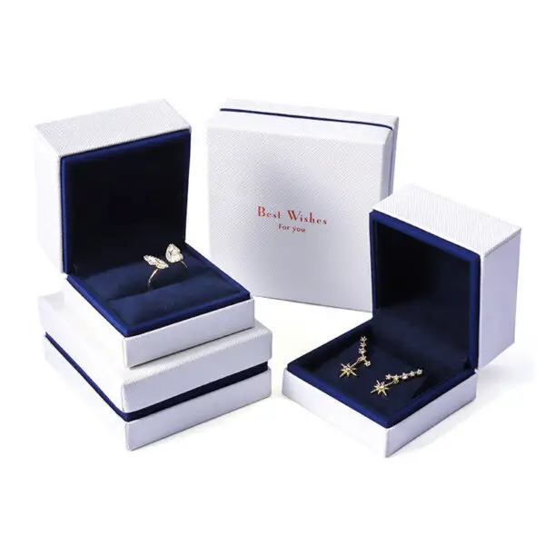 Custom white velvet earring box with branded logo, foam insert, and luxury unboxing packaging for jewelry retailers