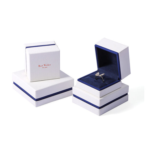 Custom white velvet earring box with branded logo, foam insert, and luxury unboxing packaging for jewelry retailers