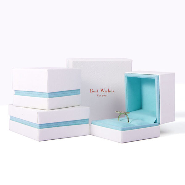 Custom white velvet earring box with branded logo, foam insert, and luxury unboxing packaging for jewelry retailers