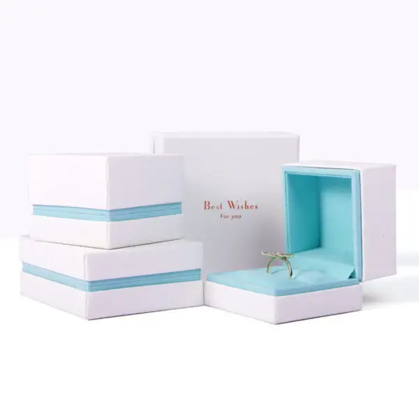 Custom white velvet earring box with branded logo, foam insert, and luxury unboxing packaging for jewelry retailers