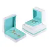 Custom white velvet earring box with branded logo, foam insert, and luxury unboxing packaging for jewelry retailers