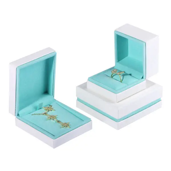 Custom white velvet earring box with branded logo, foam insert, and luxury unboxing packaging for jewelry retailers