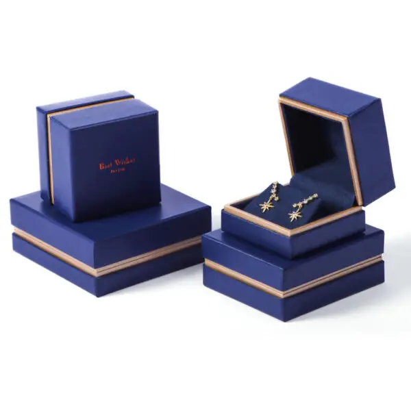 Custom white velvet earring box with branded logo, foam insert, and luxury unboxing packaging for jewelry retailers
