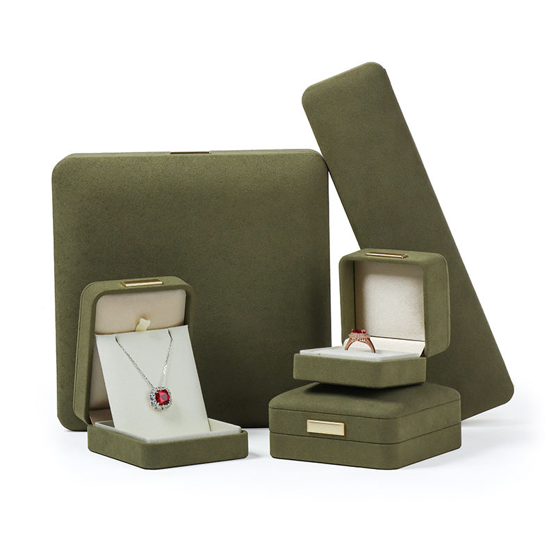 Custom cube ring box with integrated tongue-flap closure, branded with jewelry company logo, featuring soft-touch finish and velvet-lined interior padding.