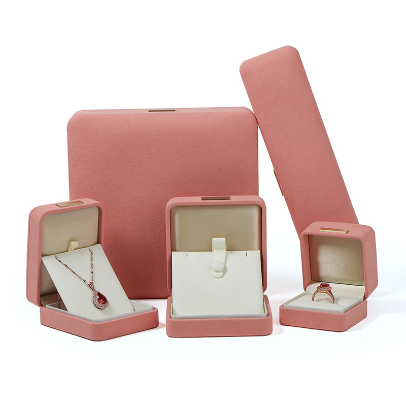 Custom cube ring box with integrated tongue-flap closure, branded with jewelry company logo, featuring soft-touch finish and velvet-lined interior padding.