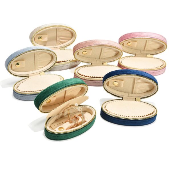 Custom velvet mini oval travel jewelry organizer box with soft interior compartments for rings, earrings, and jewelry storage