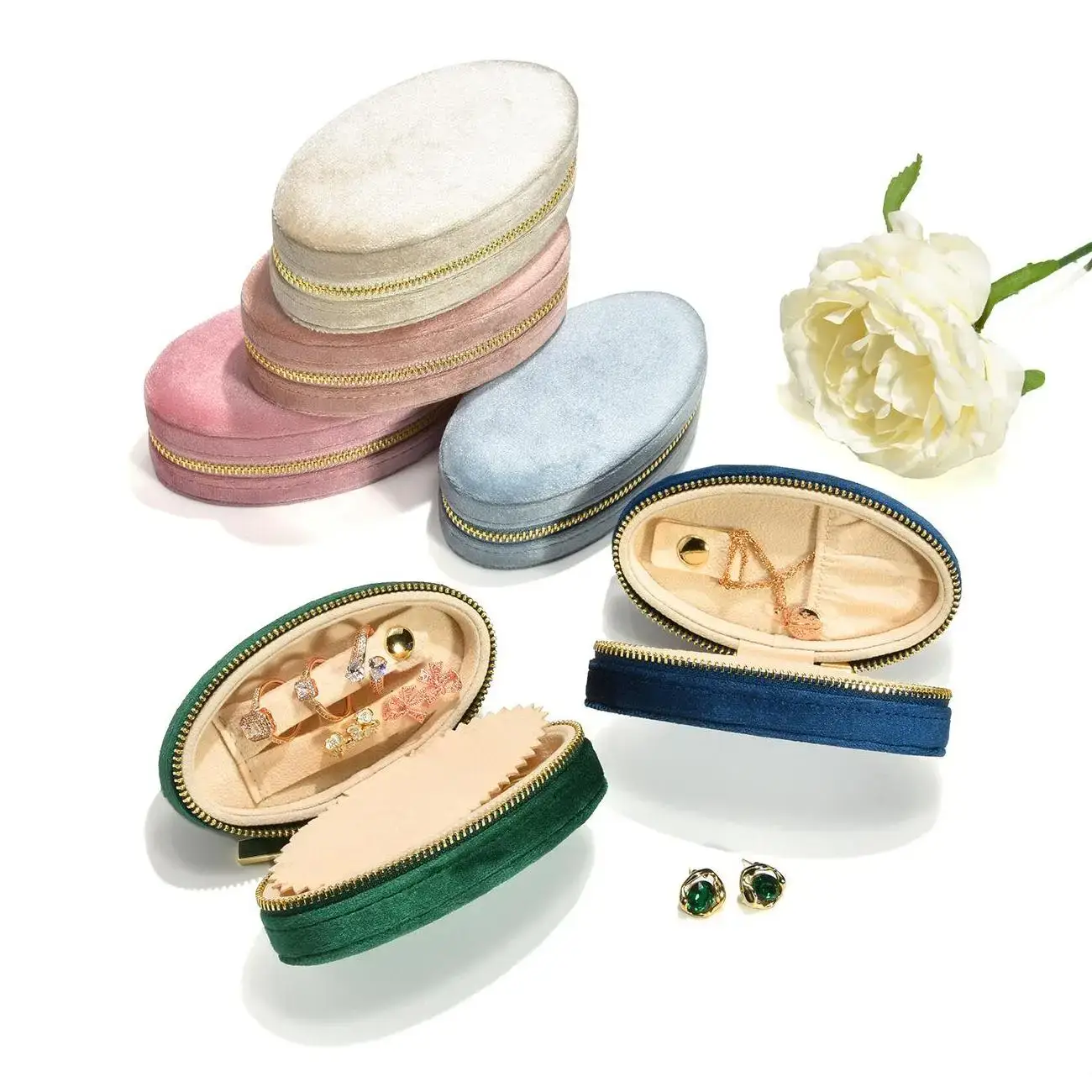 Custom velvet mini oval travel jewelry organizer box with soft interior compartments for rings, earrings, and jewelry storage