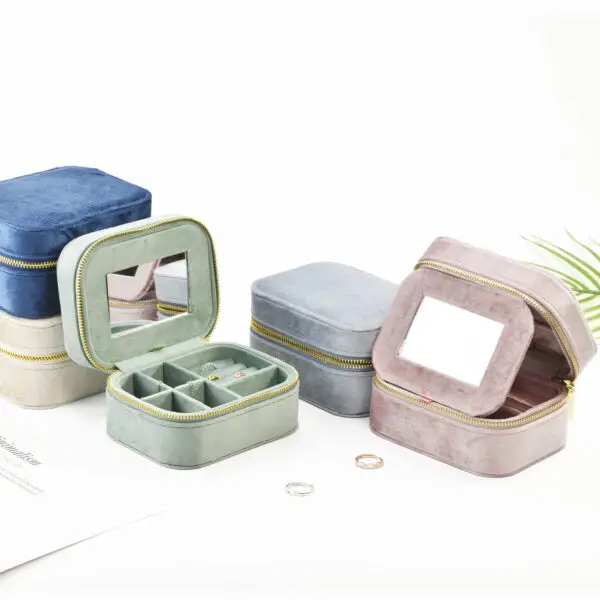 Custom velvet travel jewelry case with integrated mirror and customizable compartments for retail packaging