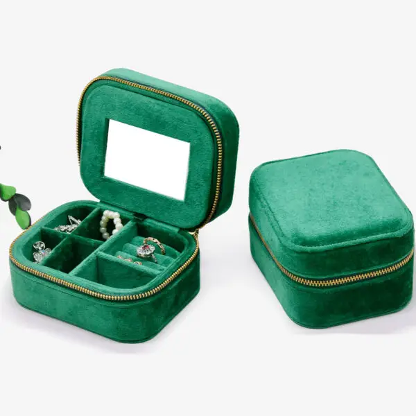 Custom velvet travel jewelry case with integrated mirror and customizable compartments for retail packaging