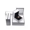 Custom white paperboard jewelry box with black border accent and protective foam insert