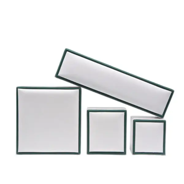Custom white paperboard jewelry box with black border accent and protective foam insert