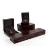 Premium custom wooden ring box with velvet insert and personalized logo branding for jewelry retail packaging.