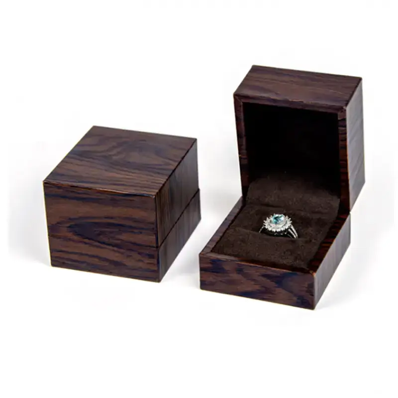 Premium custom wooden ring box with velvet insert and personalized logo branding for jewelry retail packaging.