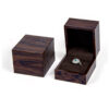 Premium custom wooden ring box with velvet insert and personalized logo branding for jewelry retail packaging.