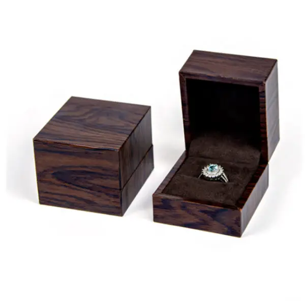 Premium custom wooden ring box with velvet insert and personalized logo branding for jewelry retail packaging.