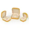 Custom yellow velvet earring box with round corners, adjustable insert, for wholesale jewelry packaging