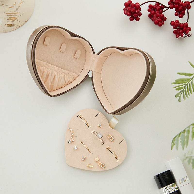 Brown heart-shaped jewelry box, open, top view.