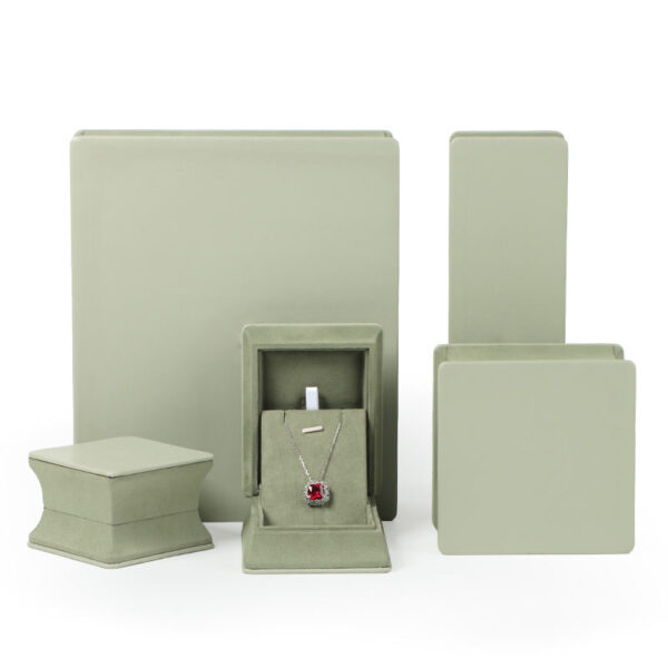 Custom leather ring jewelry boxes with waist-cinch closure, showing interior compartments and custom branding options