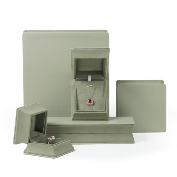 Custom leather ring jewelry boxes with waist-cinch closure, showing interior compartments and custom branding options