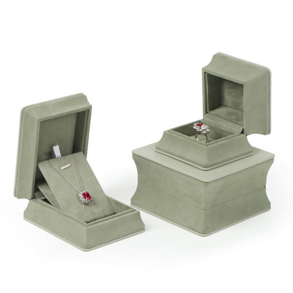 Custom leather ring jewelry boxes with waist-cinch closure, showing interior compartments and custom branding options